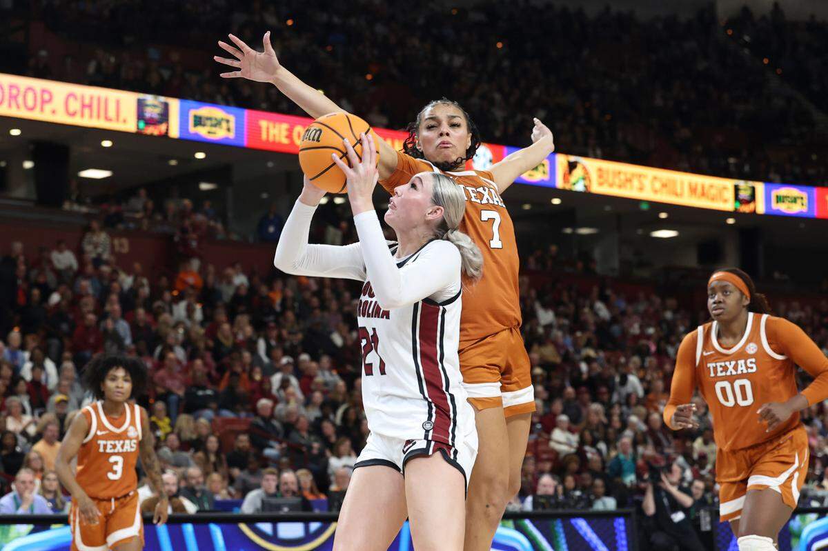 University of South Carolina’s Chloe Kitts (21) shoots as Texas’ Jordan Lee (7) defends during the second half of action in the SEC Tournament at the Bon Secours Wellness Arena in Greenville on Sunday, March 9, 2025.