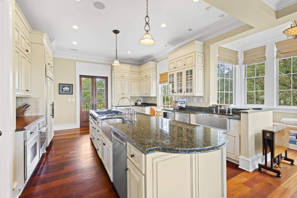 The kitchen has double ovens, a Viking range, Subzero refrigerator, warmer drawer, microwave, wine cooler, and two dishwashers.