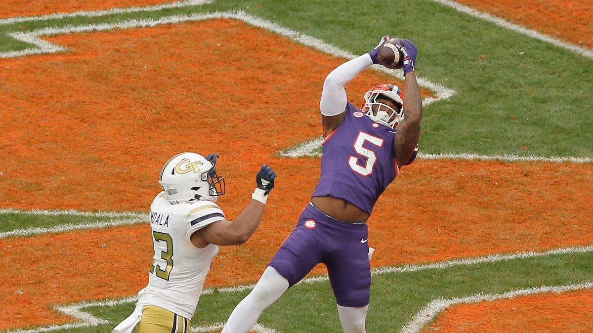 Clemson tight end Josh Sapp (5) hangs on to a touchdown pass in front of Georgia Tech linebacker Paul Moala (13) during second-half action in Clemson, S.C. on Saturday, Nov. 11, 2023.