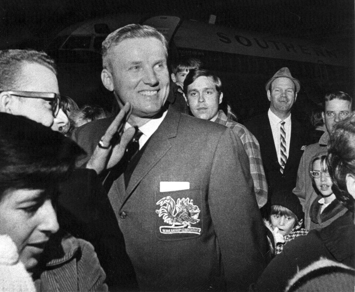 USC football coach Paul Dietzel waves to the crowd at the Columbia Metropolitan Airport upon arriving in Columbia after the Gamecock’s victory over Wake Forest to give them their first ACC football championship in 1969.