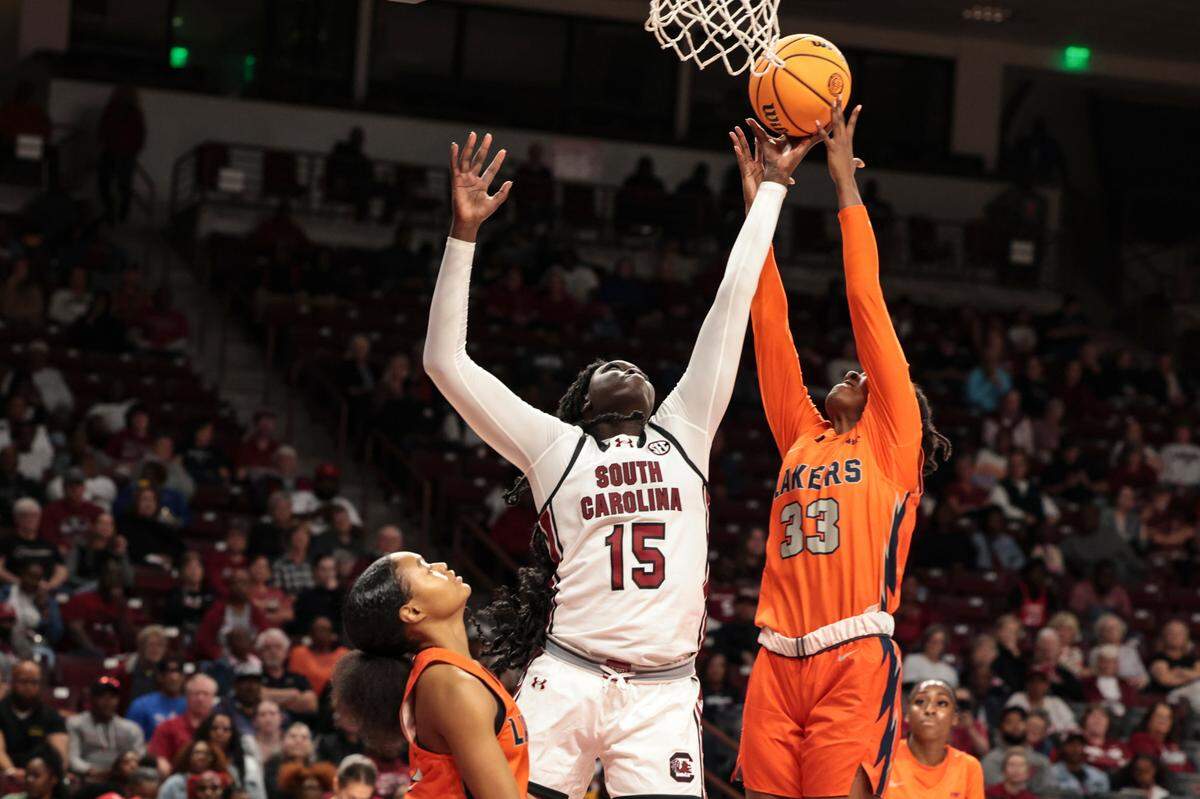 University of South Carolina forward Adhel Tac (15) snags a rebound as Clayton State’s Etaria Gibbons (33) pressures during the second half of action in the Colonial Life Arena on Monday, Oct. 28, 2024.