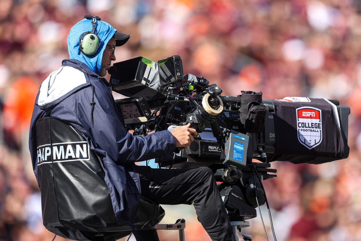 An ESPN cameraman films the action during a game between the Virginia Tech Hokies and the Miami Hurricanes at Lane Stadium on November 22, 2025 in Blacksburg, Virginia.