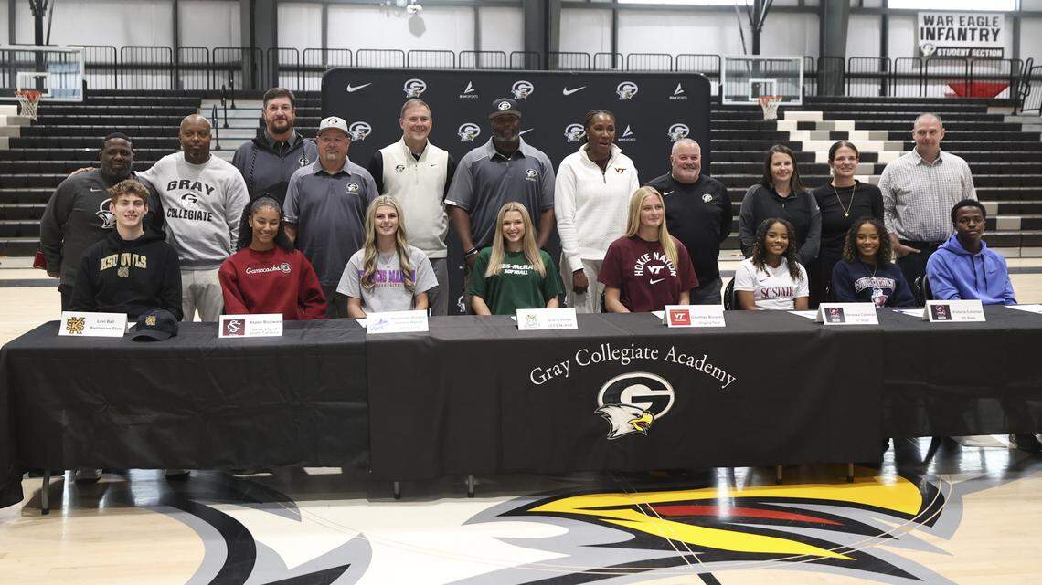 Gray Collegiate' had eight students commit to colleges during signing day on Wednesday, Nov. 12, 2025. Pictured with their coaches are, from left, Levi Ball, Basketball (Kennesaw State), Aspen Boulware, Softball (South Carolina), Mackenzi Bradley, Softball (Francis Marion), Gracie Porter, Softball (Lees-McRae), Courtney Burgess, Volleyball (Virginia Tech), Vanessa Coleman, Soccer (SC State),Victoria Coleman, Soccer (SC State), and Aaron Willis, swimming (Gardner-Web).