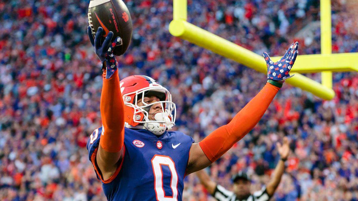 Clemson wide receiver Antonio Williams celebrates after scoring a touchdown in the first half of an NCAA college football game against Louisville, Saturday, Nov. 12, 2022, in Clemson, S.C. (AP Photo/Jacob Kupferman)