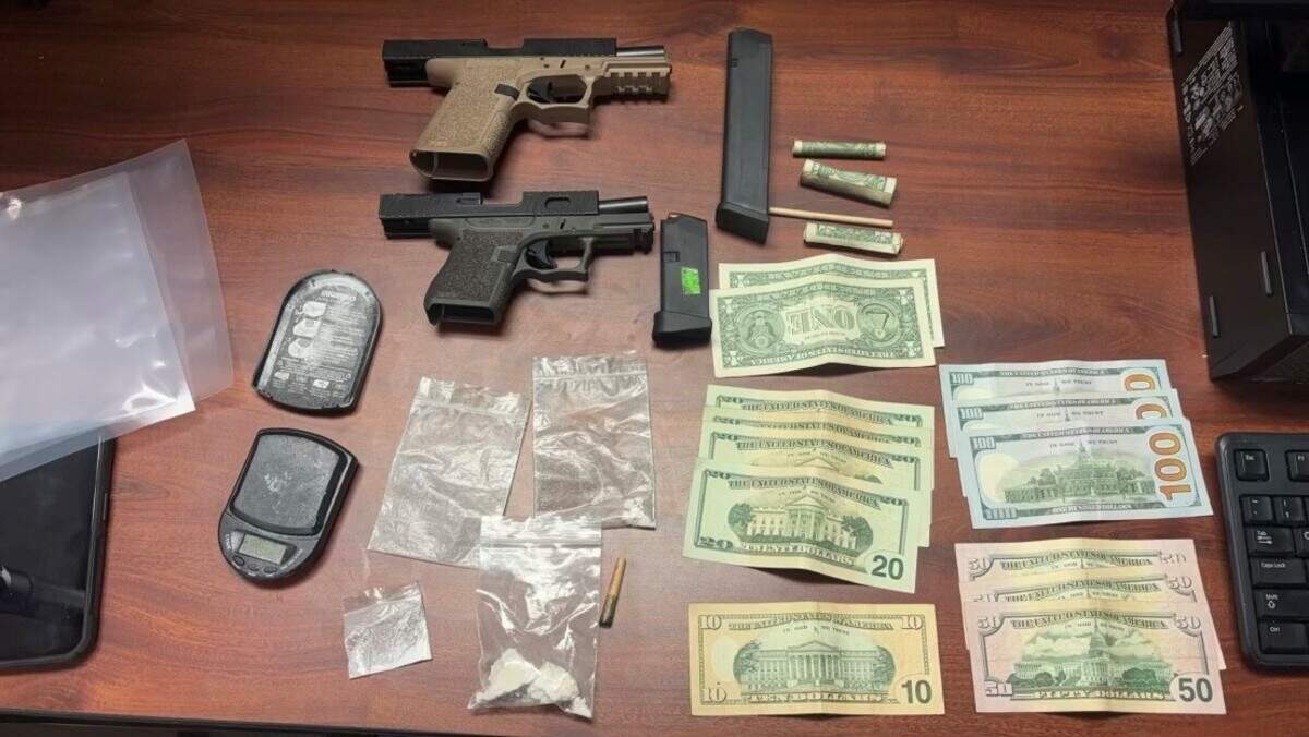 Guns, drugs, cash and more were seized following a traffic stop.