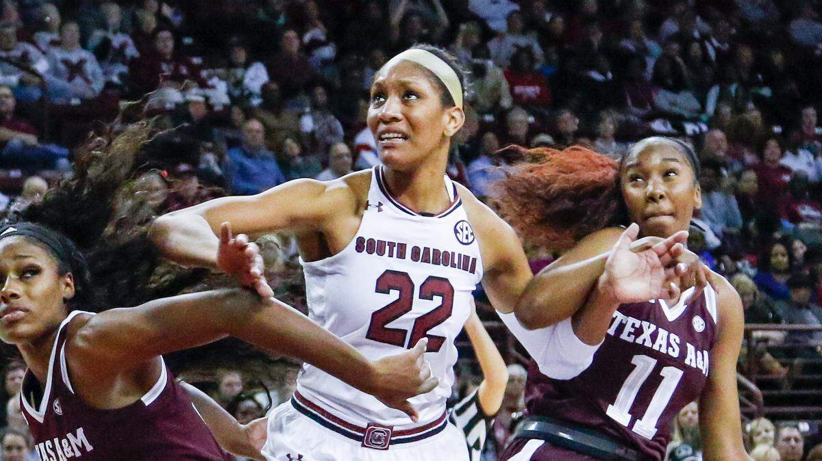 South Carolina’s A’ja Wilson (22) fends off Texas A&M’s Anriel Howard (5) during the first half of action in the Colonial Life Arena. 12/31/17