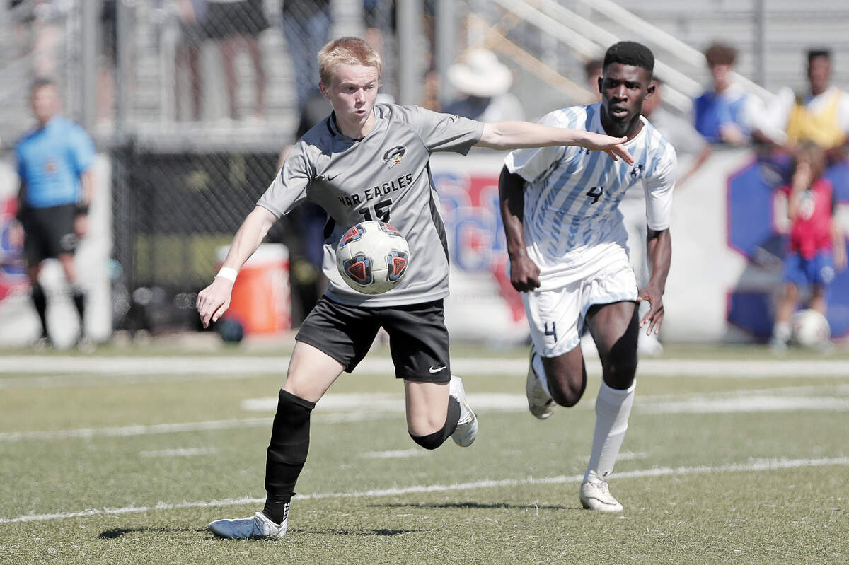 Gray Collegiate’s Ben Richards battles for the ball against Christ Church during the 2022 Class 2A boys soccer state championship match Saturday, held at Irmo High School.