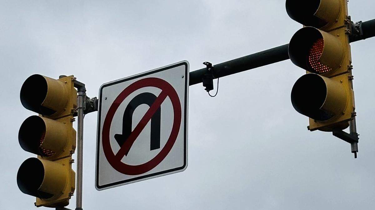 An image of traffic lights displaying yellow signals.