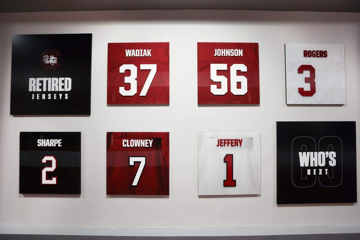 A wall of retired jerseys is displayed at the new preview center for luxury seating planned at Williams-Brice Stadium. The University of South Carolina has designed a preview center in the Bignon Gameday Center, adjacent to the stadium.