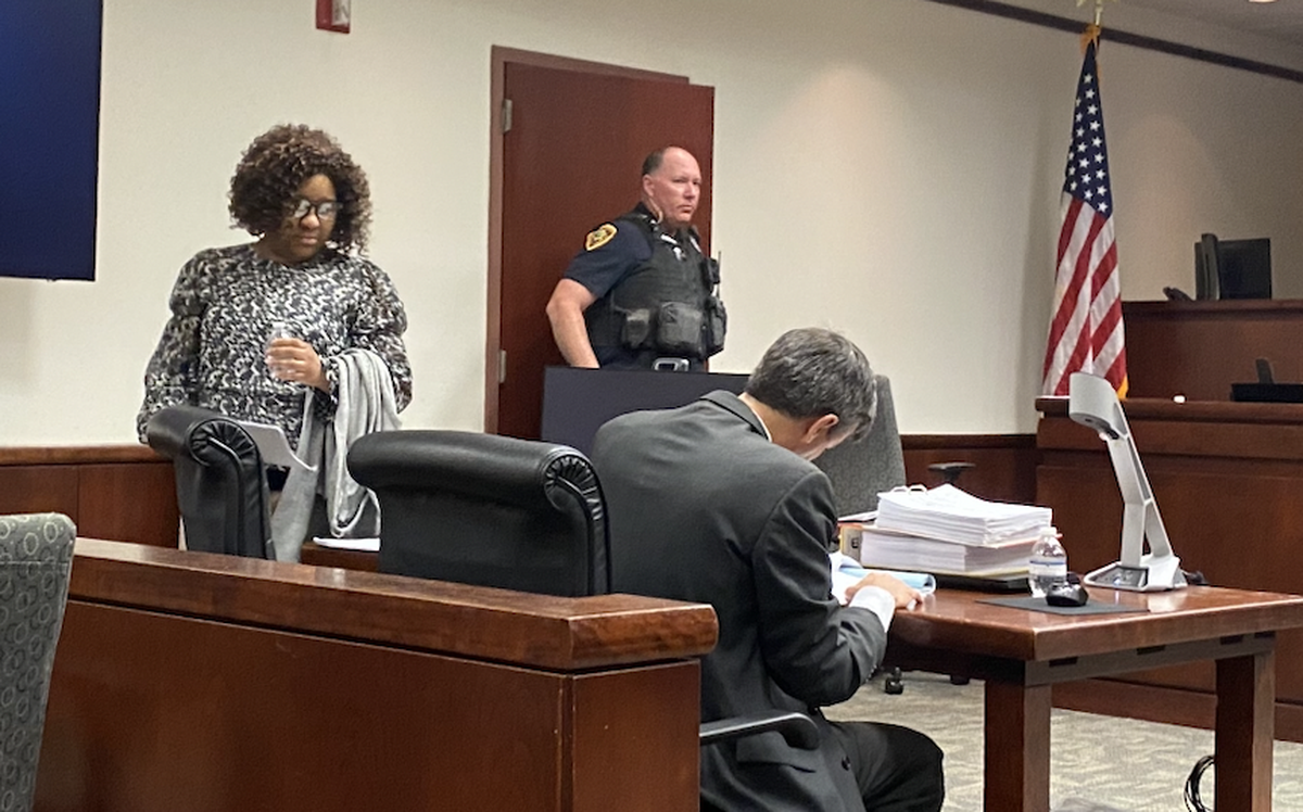 Ariel Robinson walks into the courtroom moments before her husband testified against her. She is accused by killing their foster child.