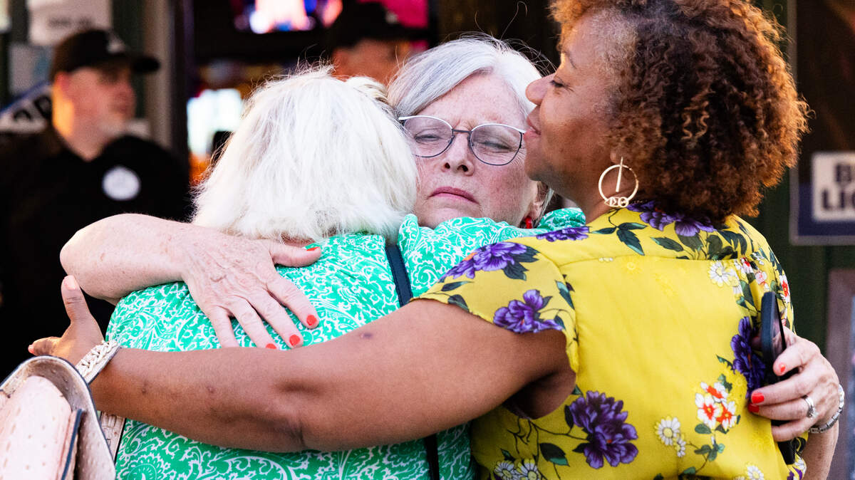 District 23 Senator Katrina Shealy, R-Lexington, is embraced by Senator Penry Gustafson, R-Camden, and Senator Tameika Isaac Devine, D-Richland, after conceding the run-off primary after “not seeing a path to victory” at Bubba’s Pub ‘N Grub in Lexington on Tuesday, June 25, 2024.