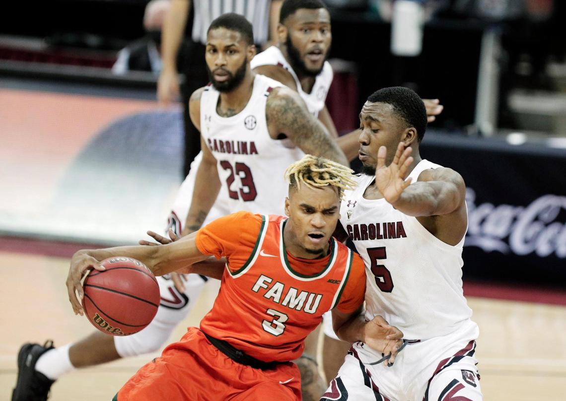 Florida A&M Rattlers guard MJ Randolph (3) is defended by South Carolina Gamecocks guard Jermaine Couisnard (5) at Colonial Life Arena on January, 2, 2021.