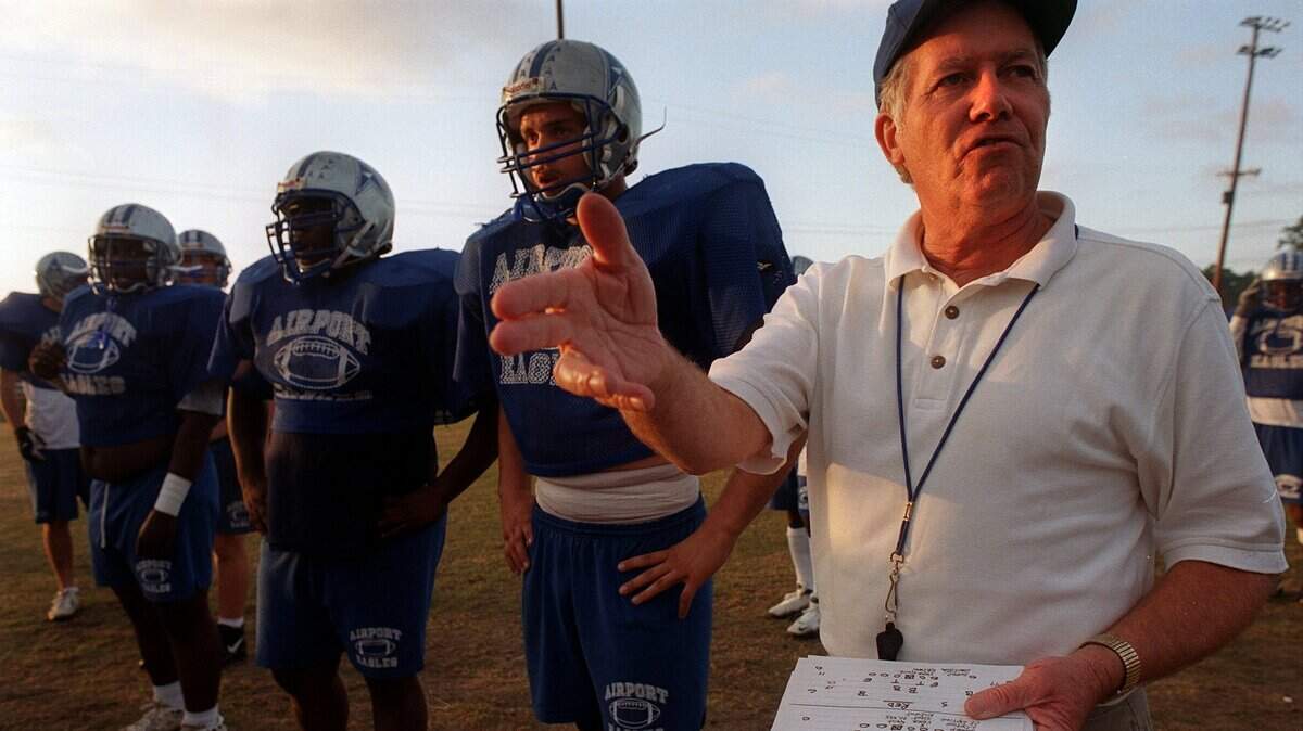 Former Airport football coach Les Evans talks to his team during 1999 season. Evans died on Thursday, July 1, 2021.