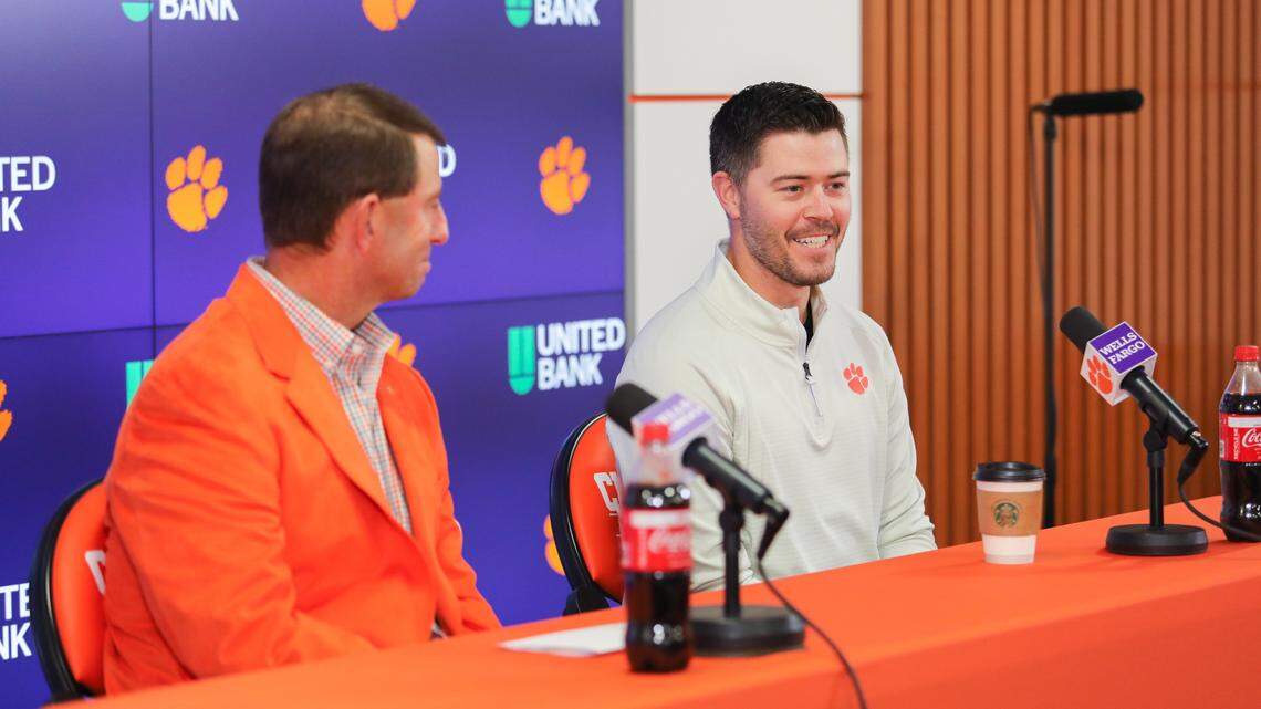 Clemson offensive coordinator Garrett Riley speaks to the media alongside head coach Dabo Swinney on Wednesday.