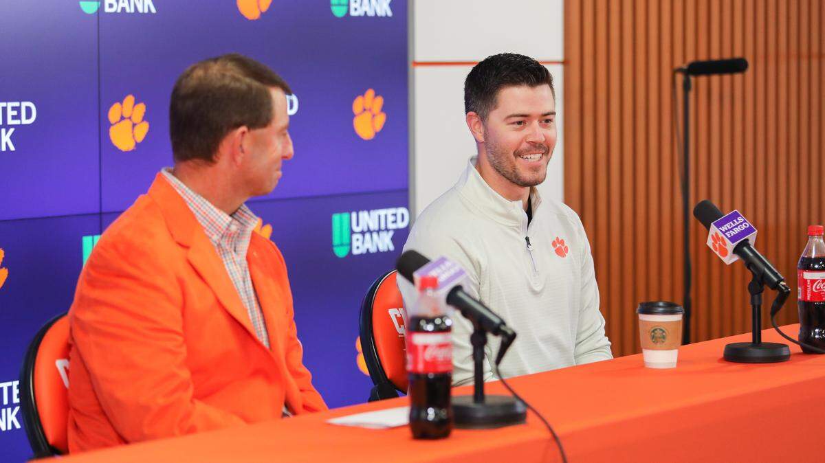 Clemson offensive coordinator Garrett Riley speaks to the media alongside head coach Dabo Swinney on Wednesday.