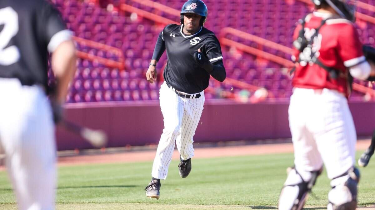 South Carolina infielder Michael Braswell (7) scores during the Sunday scrimmage at Founders Park.