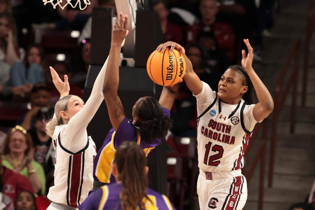 University of South Carolina’s MiLaysia Fulwiley (12) and Chloe Kitts (21) block Tennessee Tech’s Chloe Larry (21)during the first half of action in the First Round game of the NCAA Tournament at the Colonial Life Arena on Friday, March 21, 2025.