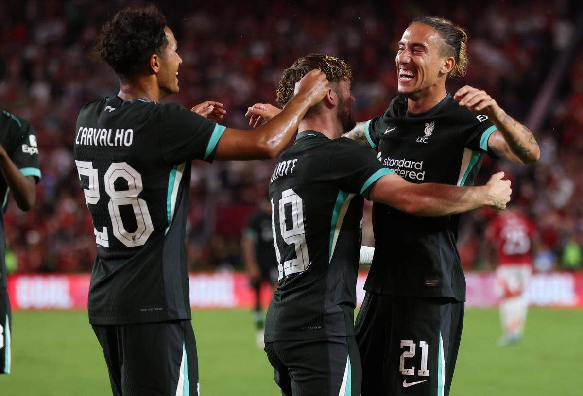 Liverpool defender Kostas Tsimikas (21) celebrates with teammates after scoring during the Rivals in Red International Friendly soccer match between Manchester United and Liverpool in Columbia on Saturday, August 3, 2024.