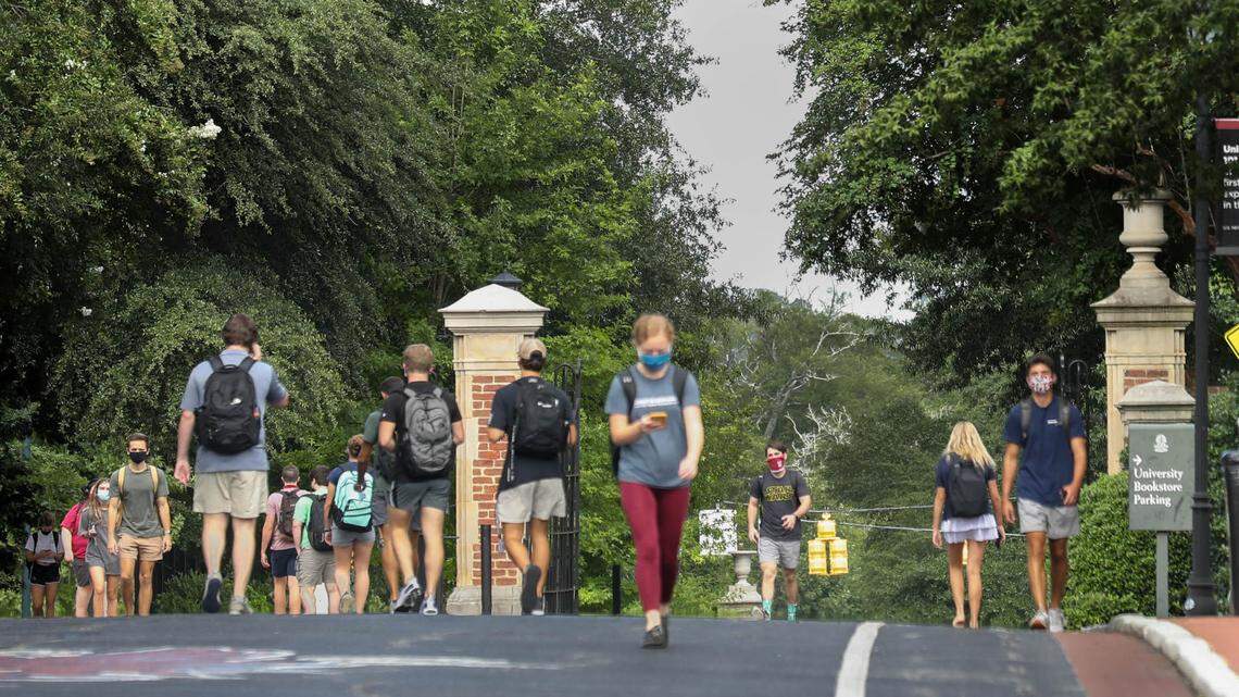Students wearing masks walk on campus at the University of South Carolina. 8/26/20