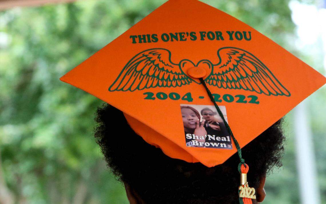 Eau Claire High School senior Tequan Green has a memorial to his friend, Sha’Neal Brown on his mortar board. Brown, along with fellow senior, Troy Ganaway died recently in separate incidents.