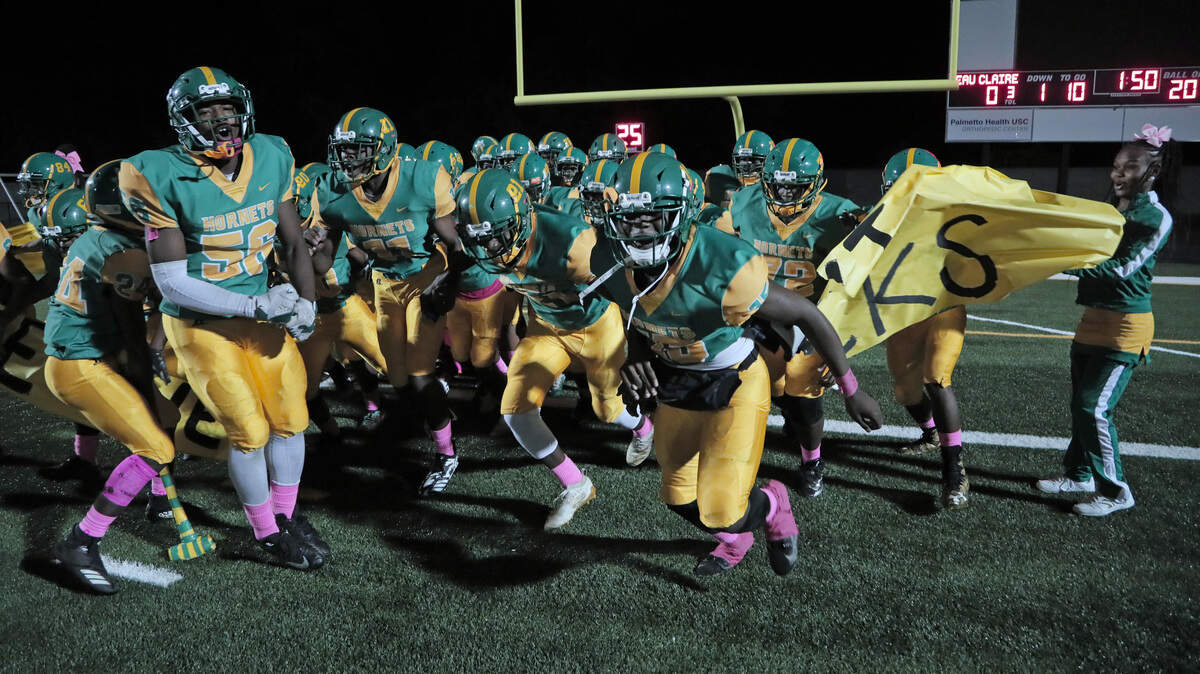 The CA Johnson Hornets take the field Oct. 18 for their game against Eau Claire at Bolden Stadium. The Hornets are having one of their best seasons in recent history thanks in part to having more students come out to play football.