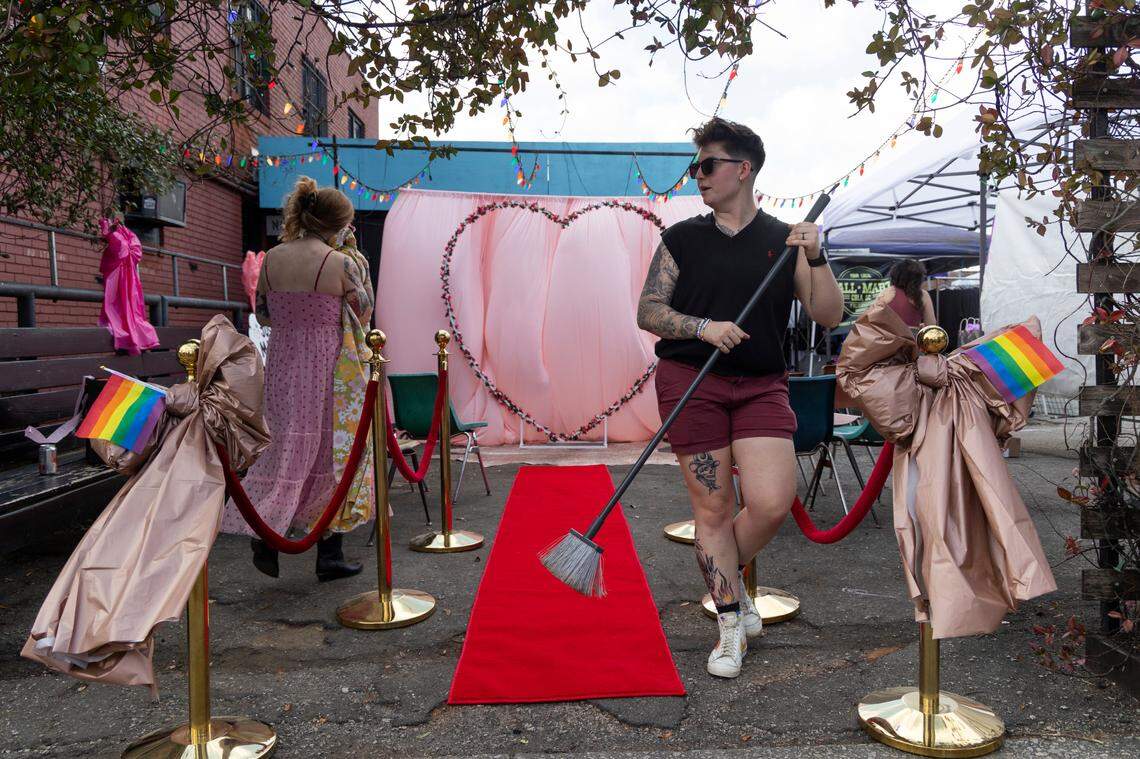 Harriet Hancock Center volunteers clean the temporary wedding venue at Y’all-Mart, a quarterly art fair series, at Art Bar in Columbia, South Carolina on Sunday, February 9, 2025. Eight couples married between 1 p.m. and 5 p.m.