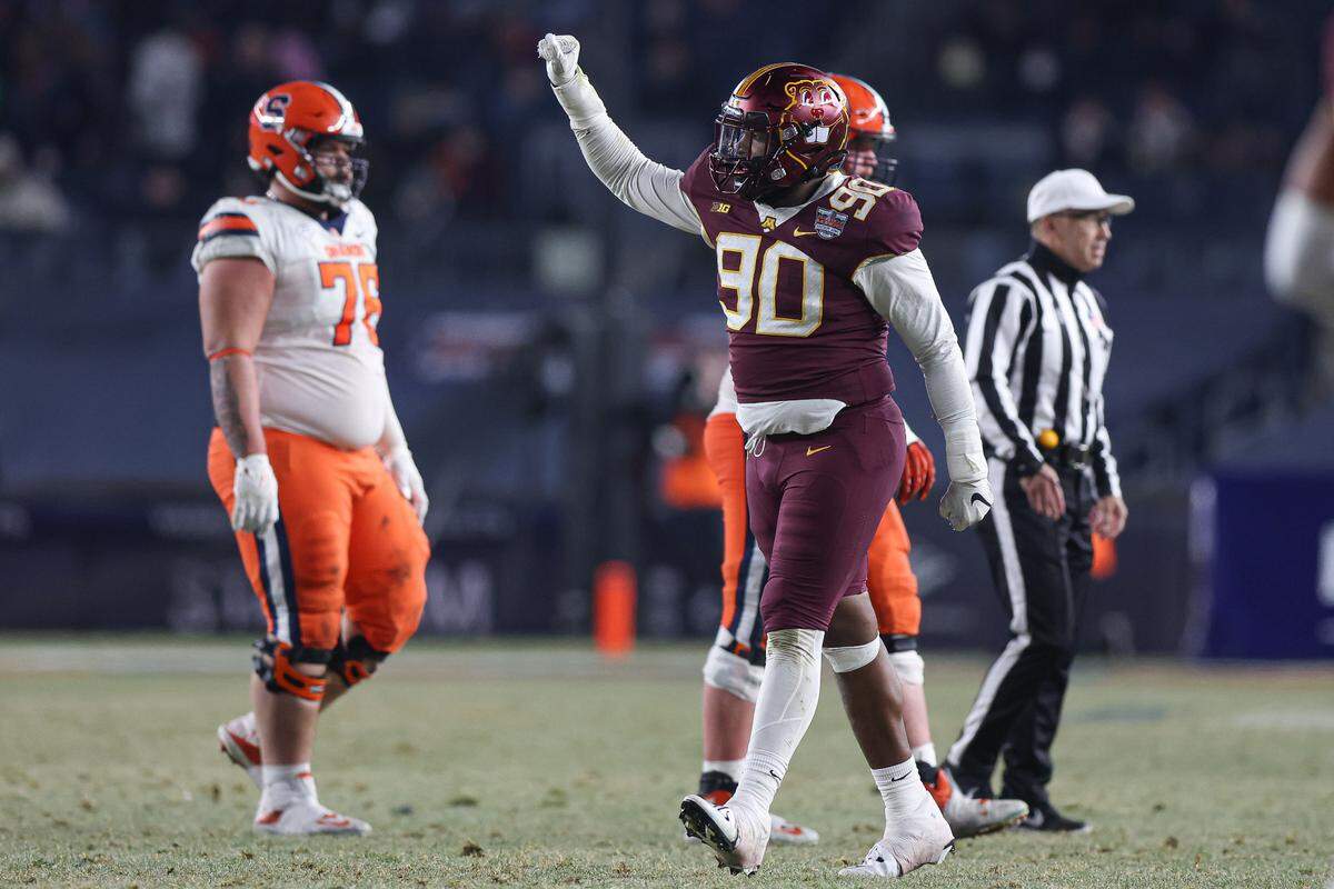Dec 29, 2022; Bronx, NY, USA; Minnesota Golden Gophers defensive lineman Darnell Jefferies (90) celebrates after a defensive stop during the second half of the 2022 Pinstripe Bowl against the Syracuse Orange at Yankee Stadium.
