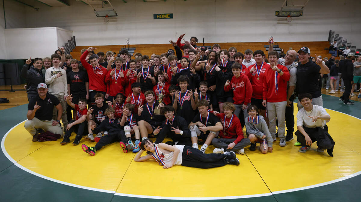 Cardinal Newman wrestlers celebrate their win in the SCISA Wrestling State Championships at Ben Lippen in Columbia on Saturday, Feb. 1, 2025.