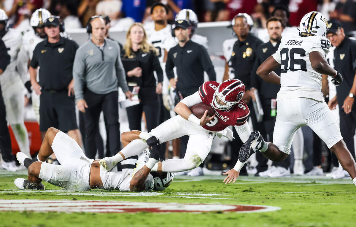 South Carolina quarterback Luke Doty (9) gets wrapped up during the first half of the Gamecocks’ game against Vanderbilt at Williams-Brice Stadium in Columbia on Saturday, September 13, 2025.