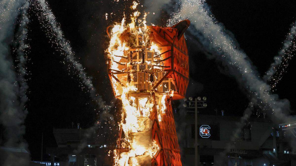 The 20-foot-tall Clemson Tiger goes up in flames during the annual Tiger Burn at the University of South Carolina intramural fields on Monday, Nov. 21, 2022, at Charleston Southern University. Students from the American Society of Mechanical Engineers constructed the tiger effigy.