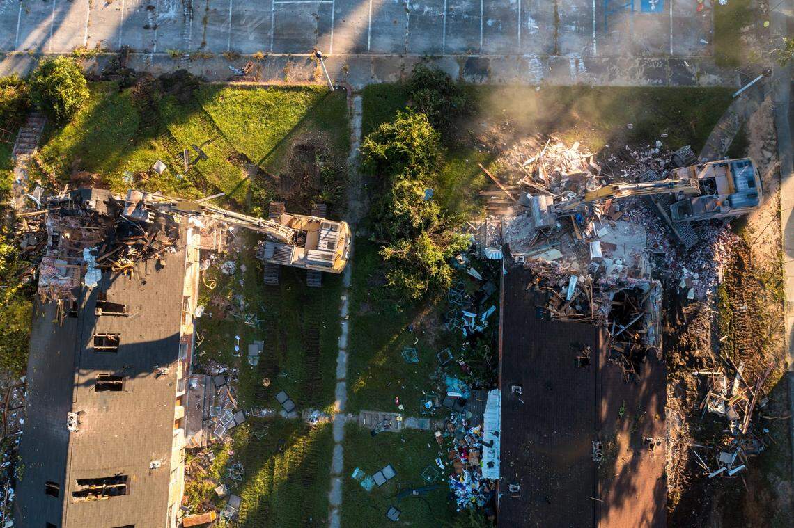 Crews demolish Allen Benedict Court Tuesday morning. The housing complex was built in 1940.