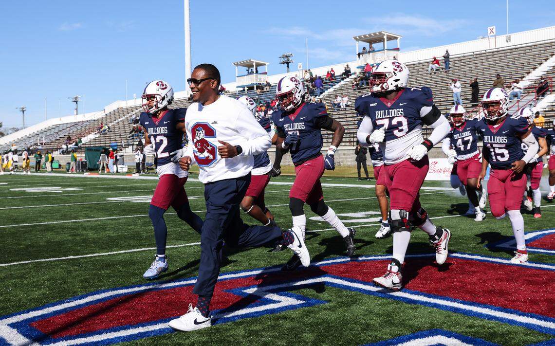 South Carolina State head coach Chennis Berry leads his team out before South Carolina State’s game against Norfolk State at Oliver C. Dawson Stadium in Orangeburg on Saturday, November 23, 2024.