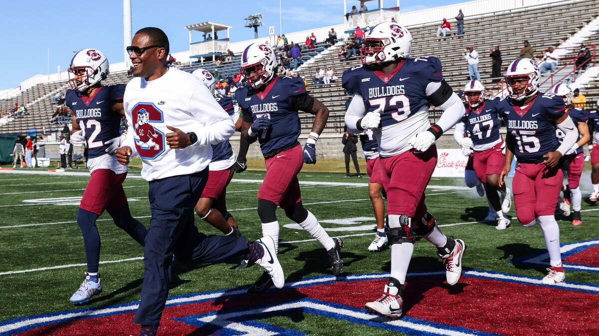 South Carolina State head coach Chennis Berry leads his team out before South Carolina State’s game against Norfolk State at Oliver C. Dawson Stadium in Orangeburg on Saturday, November 23, 2024.