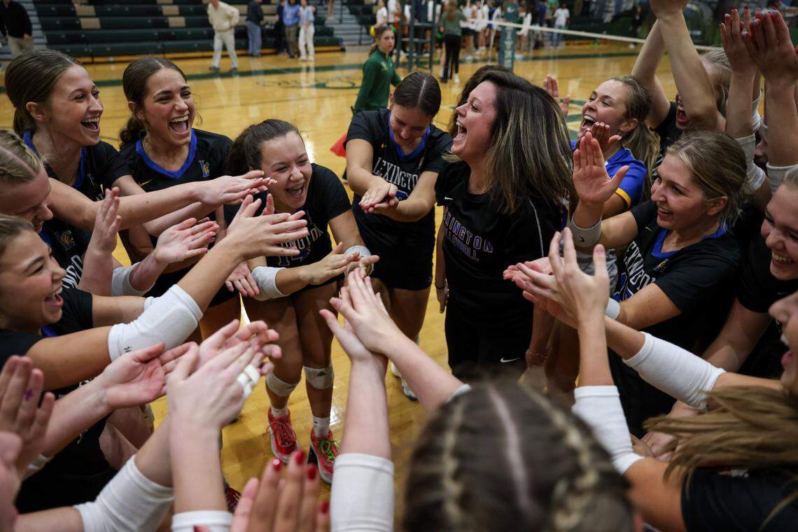 Lexington head coach Erica Hardin celebrates with her team following their match against River Bluff at River Bluff in Columbia on Thursday, October 17, 2024.
