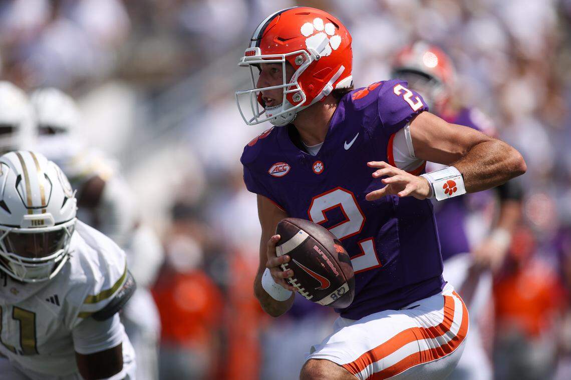 Clemson Tigers quarterback Cade Klubnik (2) scrambles against the Georgia Tech Yellow Jackets in the second quarter at Bobby Dodd Stadium at Hyundai Field.