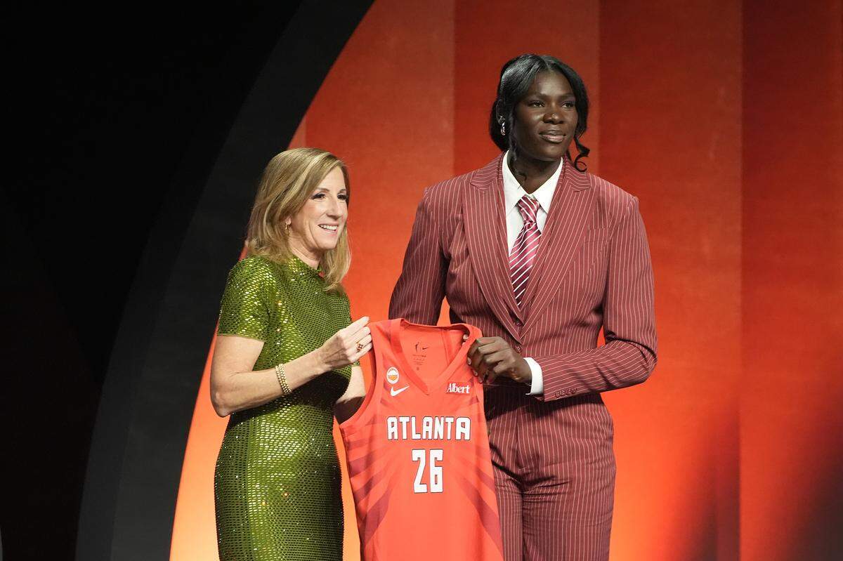 Madina Okot of Kenya poses with WNBA Commissioner Cathy Engelbert after being selected Monday with the 13th pick in the first round by the Atlanta Dream during the 2026 WNBA Draft at The Shed in New York City.