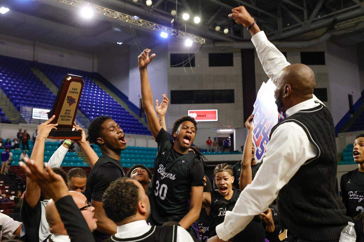 The Ridge View Blazers celebrate winning the Class 4A boys basketball championship game on Saturday, March 2, 2024 at the Florence Center. Ridge View beat Riverside 55-52.