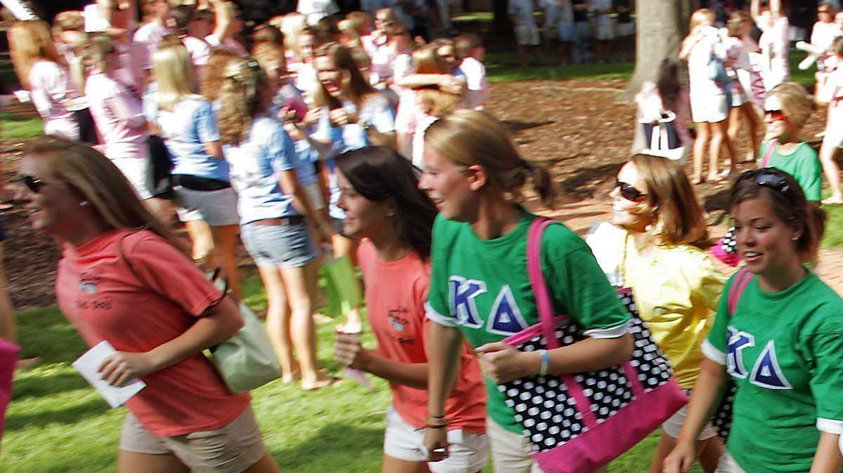 File Photo: New pledges including Emily Thilo, second from right, and Chloe Thurston, right, race towards their new sororities after taking part in Bid-Day.