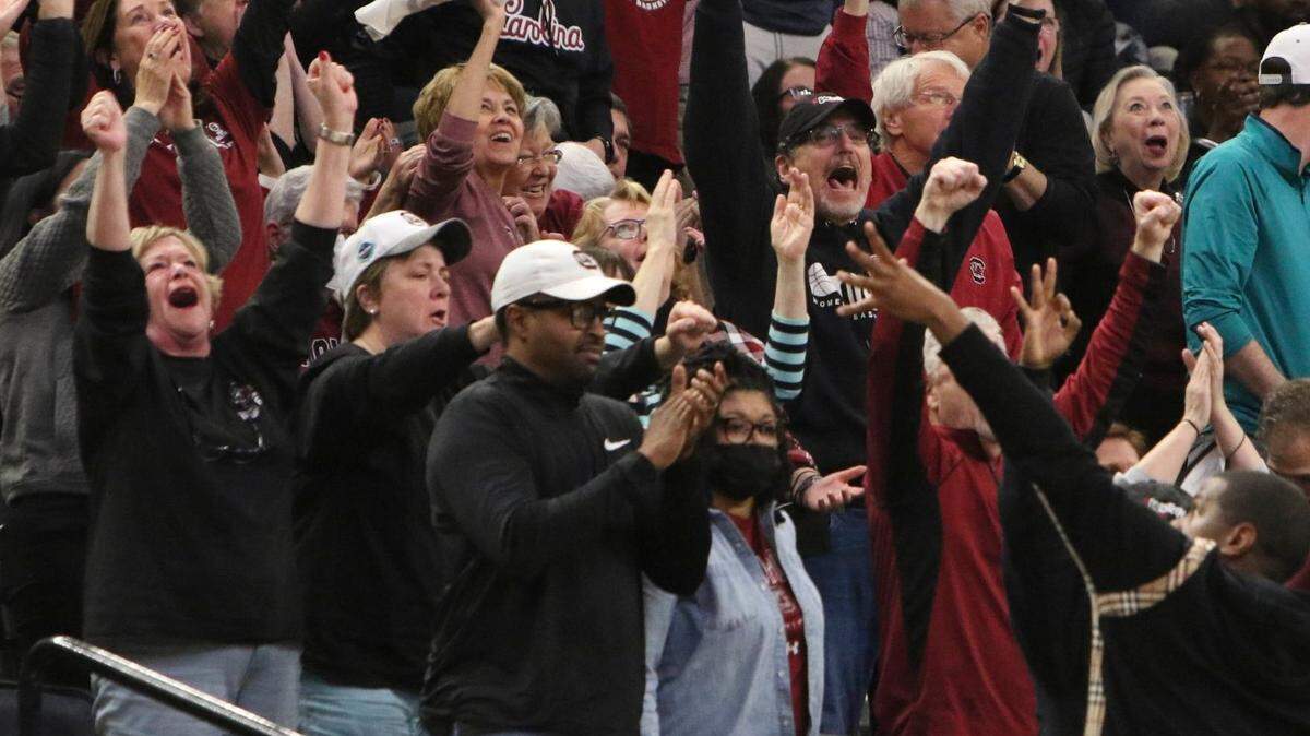 Fans celebrate during the first half of the national championship game against UConn at the Target Center in Minneapolis, Minn. on Sunday April 3, 2022.