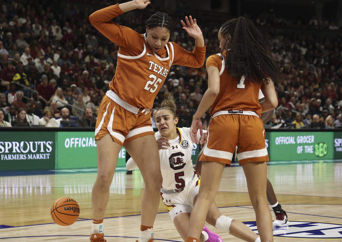 South Carolina's Tessa Johnson (5) collides with Texas’s Breya Cunningham (25) during the first half of action of their women's basketball game in the SEC Tournament, against Texas at the Bon Secours Wellness Arena on Sunday, March 8, 2026.