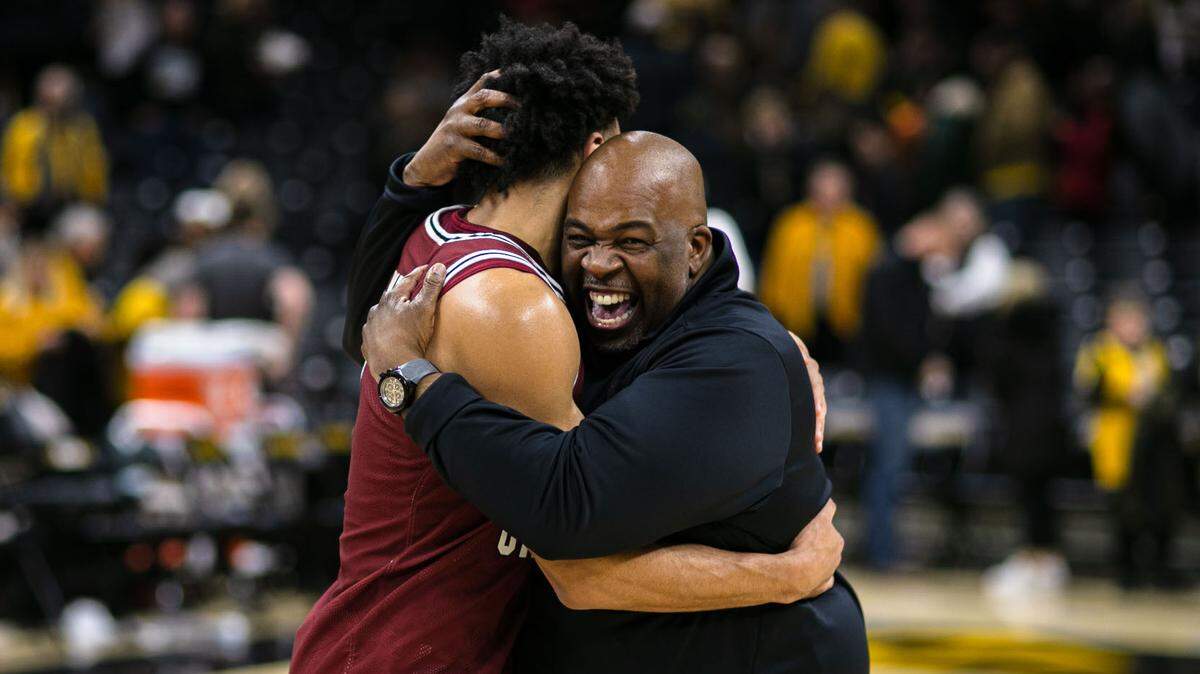 Carey Rich (Right) hugs South Carolina guard Jacobi Wright after a recent game.