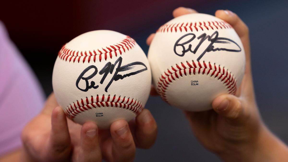 University of South Carolina’s new baseball coach, Paul Mainieri, signed baseballs for young fans Taylor Scott, 6, and Liza Scott, 8, at the Cockaboose Club on Thursday, June 13, 2024.