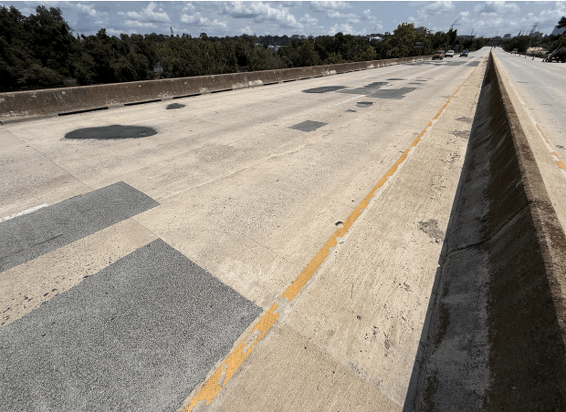 Potholes on the Jarvis Klapman Bridge, included in an SCDOT inspection report from August 2025.