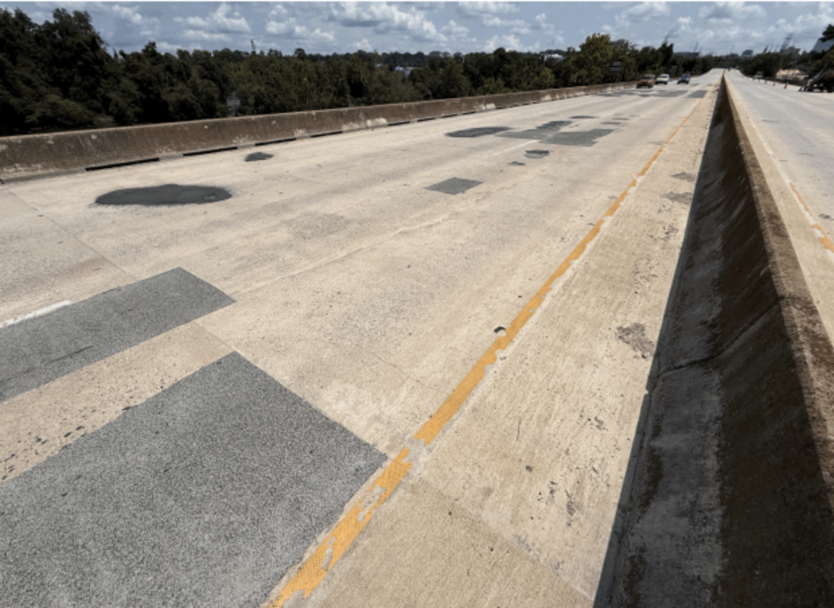 Potholes on the Jarvis Klapman Bridge, included in an SCDOT inspection report from August 2025.