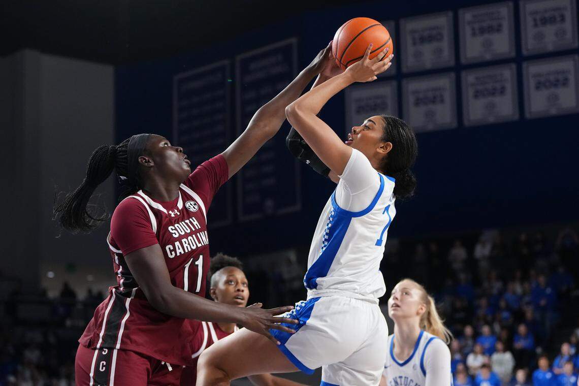 Teonni Key #7 of the Kentucky Wildcats attempts a shot while she is guarded by Madina Okot #11 of the South Carolina Gamecocks in the first quarter at Memorial Coliseum on March 1, 2026 in Lexington, Kentucky.