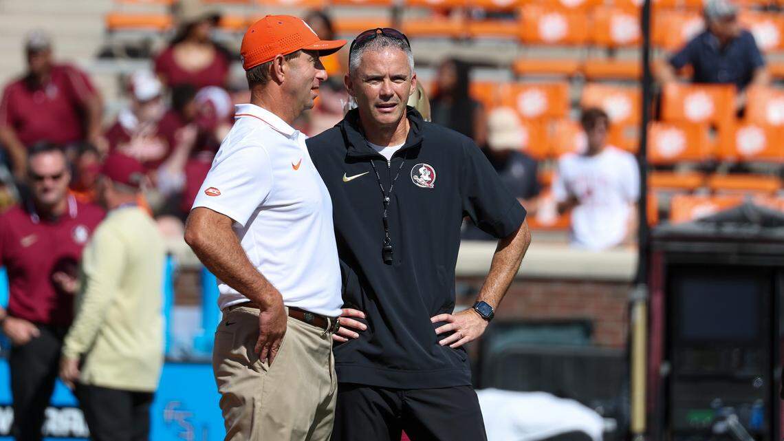 Sep 23, 2023; Clemson, South Carolina, USA; Clemson Tigers head coach Dabo Swinney (left) talks with Florida State Seminoles head coach Mike Norvell at Memorial Stadium. Mandatory Credit: David Yeazell-USA TODAY Sports
