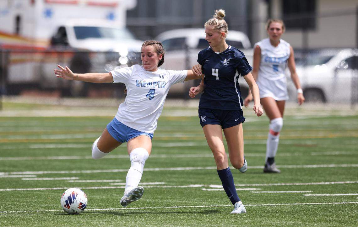 Nat Todaro (4) of Chapin pushes the ball up the field as Ava Grieves (4) of Clover defends during the second half of the SCHSL Class 5A Girls Soccer State Final at Memorial Stadium in Columbia on Friday, May 10, 2024.
