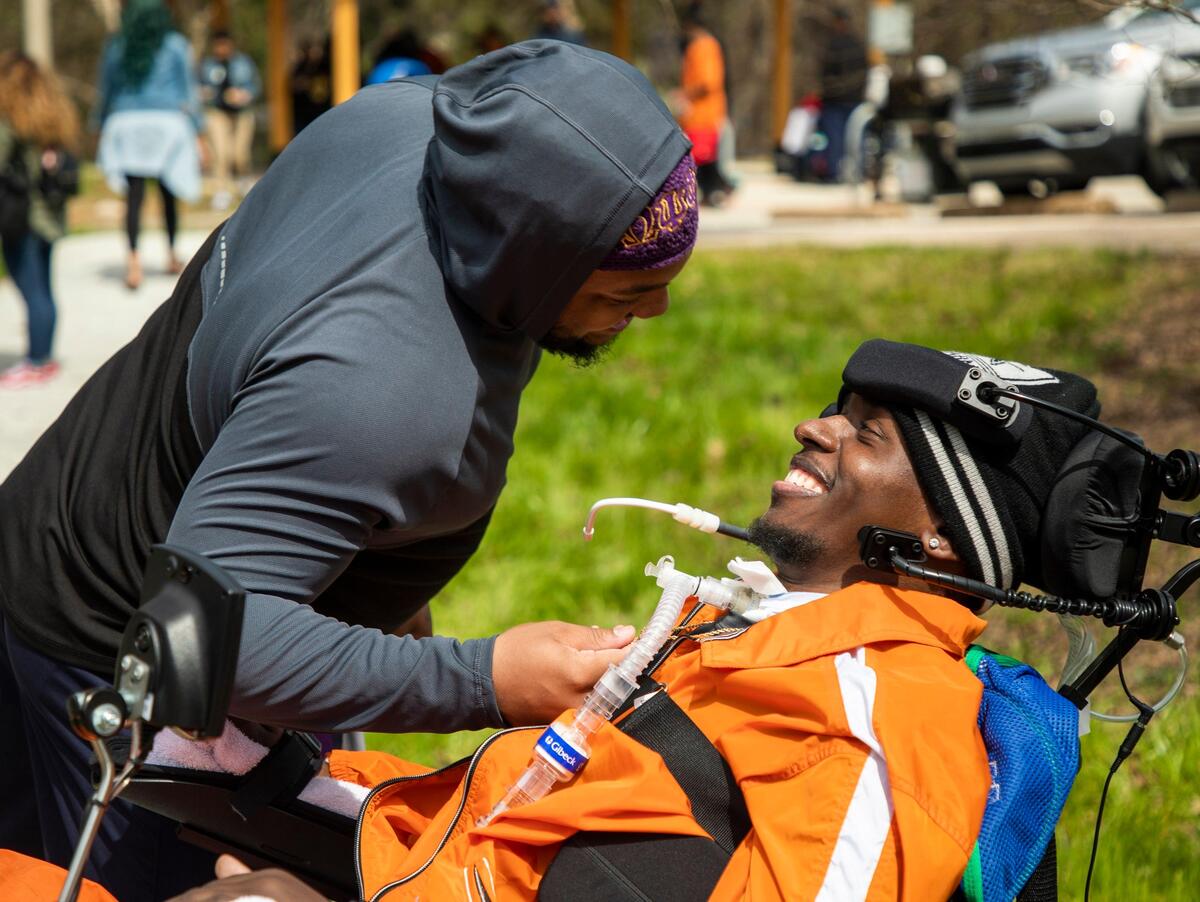 Howard Boone, right, visits with Shyheim Swinson, his Omega Psi Phi fraternity brother, during the first annual kickball tournament of Boone’s organization, Legacy 318, formed after his experience as a victim in the March 18th, 2018, shooting at Five Points in Columbia, SC, where he was paralyzed by a bullet striking his neck, in order to raise awareness about gun violence, on Saturday, Mar. 16, 2019.