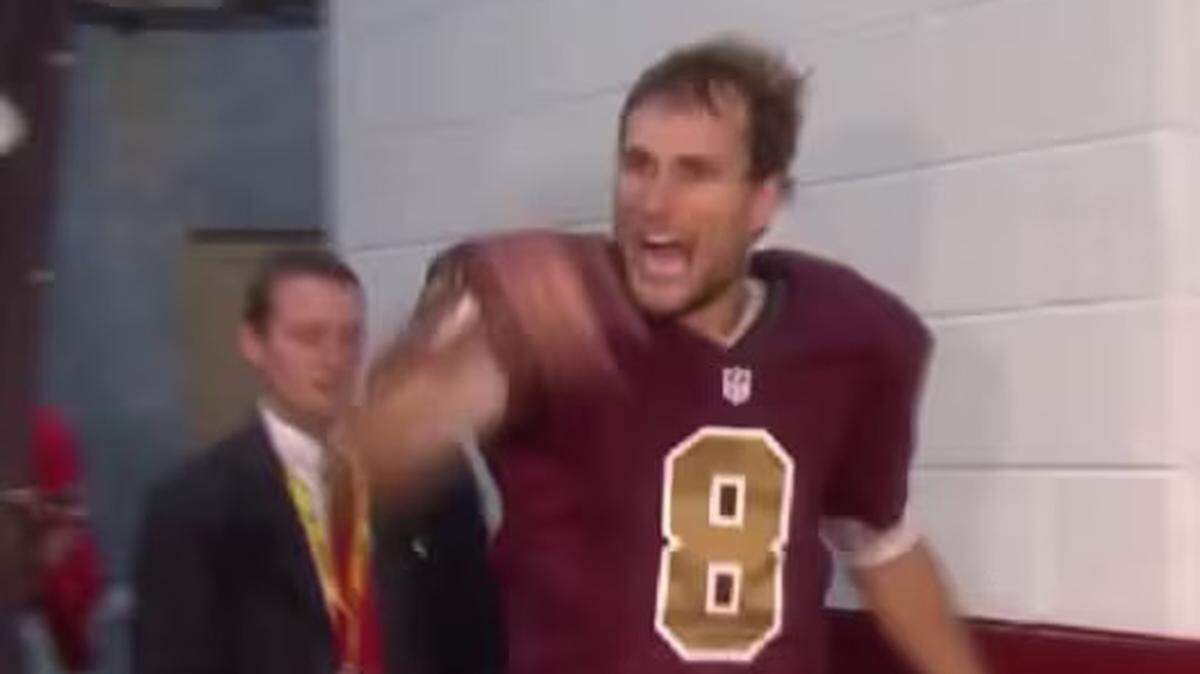 Then-Washington Redskins quarterback Kirk Cousins (right) delivers his famous ‘You like that?!’ line after a big comeback win in 2015 ... with Ross Taylor (left), now Clemson football’s director of communications, also getting caught up in the viral moment.