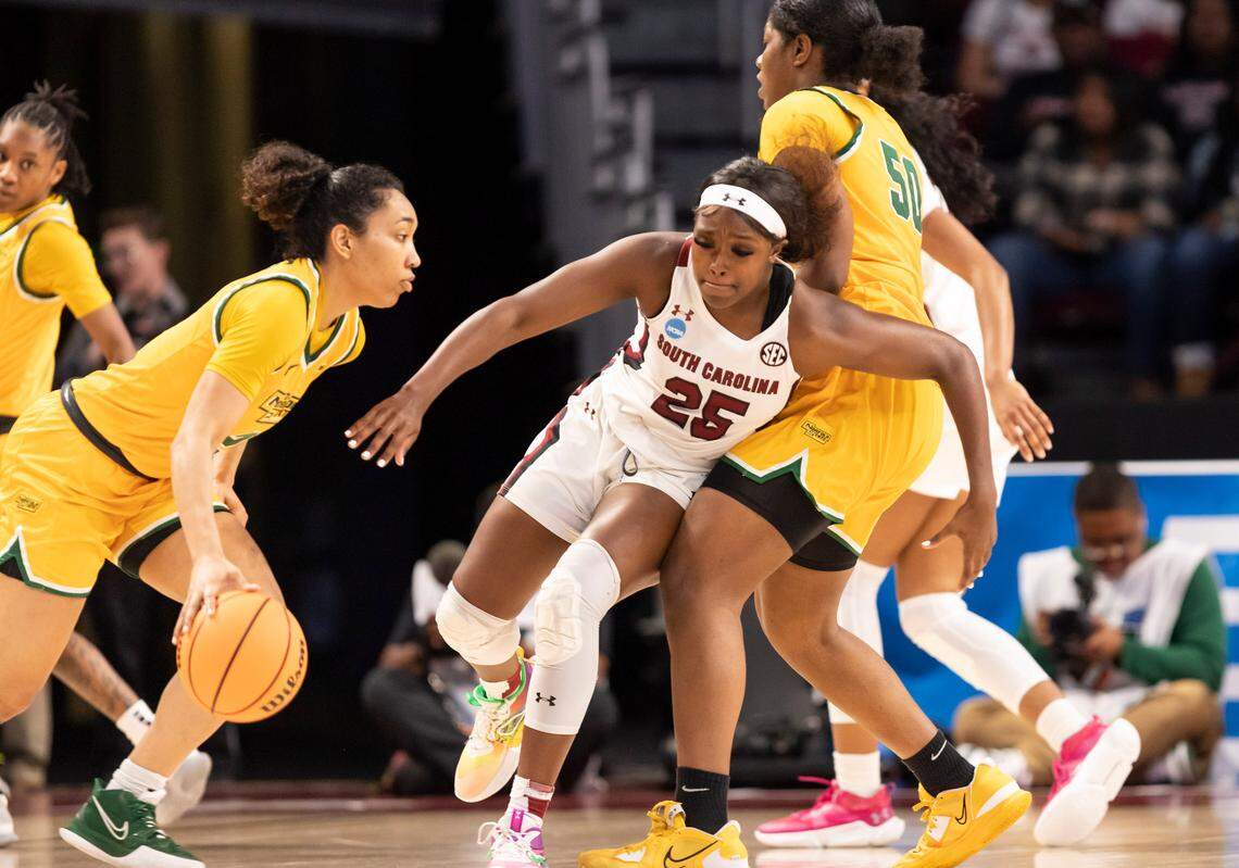 South Carolina Gamecocks guard Raven Johnson (25) runs into Norfolk State Spartans forward Kierra Wheeler (50) while Norfolk State Spartans guard Niya Fields (2) during the first round of the 2023 NCAA Tournament at Colonial Life Arena in Columbia on Friday, March 17, 2023.